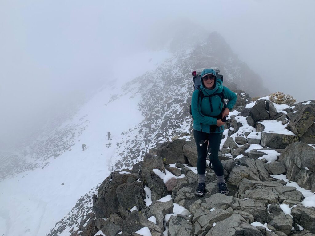 The artist on trail on a snowy Glen Pass in the Sierra Nevada on the PCT/JMT trail